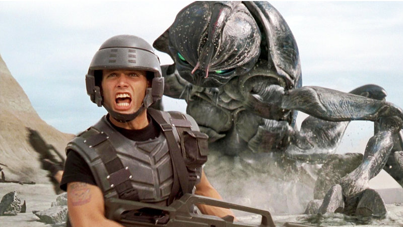 A Starship Trooper screaming as a giant bug attacks.